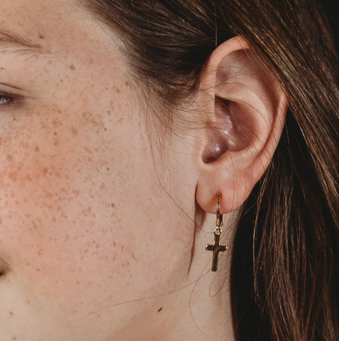 GRACE SMALL GOLD CROSS HUGGIE EARRING 1.25"