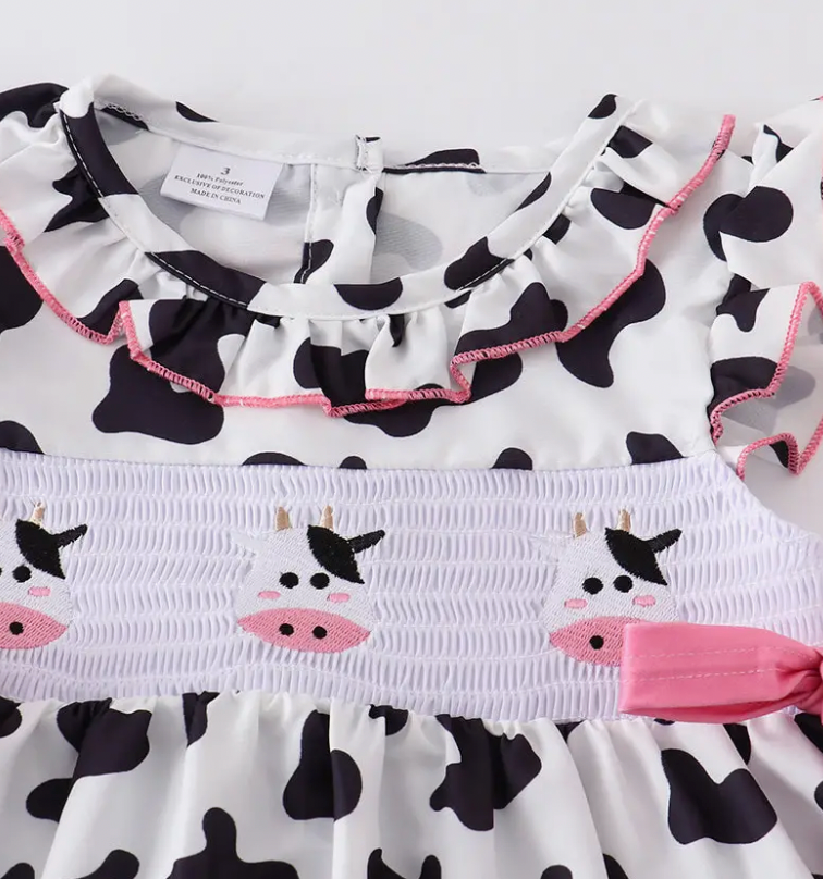 COW PRINT SMOCKED RUFFLE DRESS