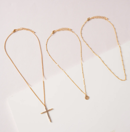 SET OF THREE NECKLACES WITH CROSS AND COIN CHARMS